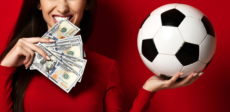 free bet woman holding money and a football