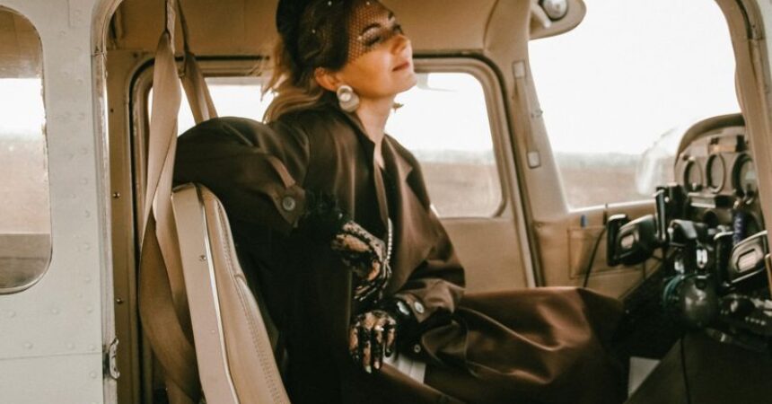 woman pilot smart dress old plane